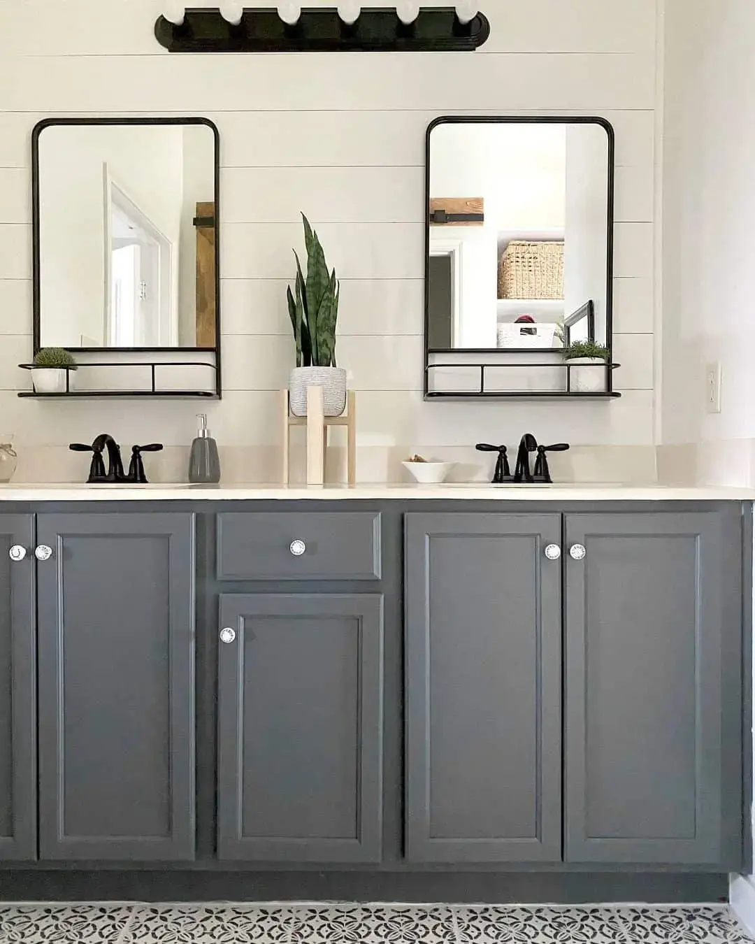 Black Metal Shelves Add Practical Storage Below Mirrors