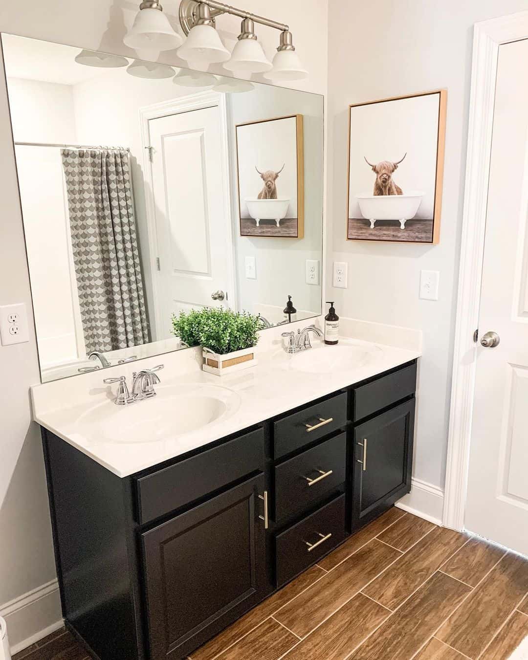 Whimsical Cow Artwork Adds Personality Above the Vanity