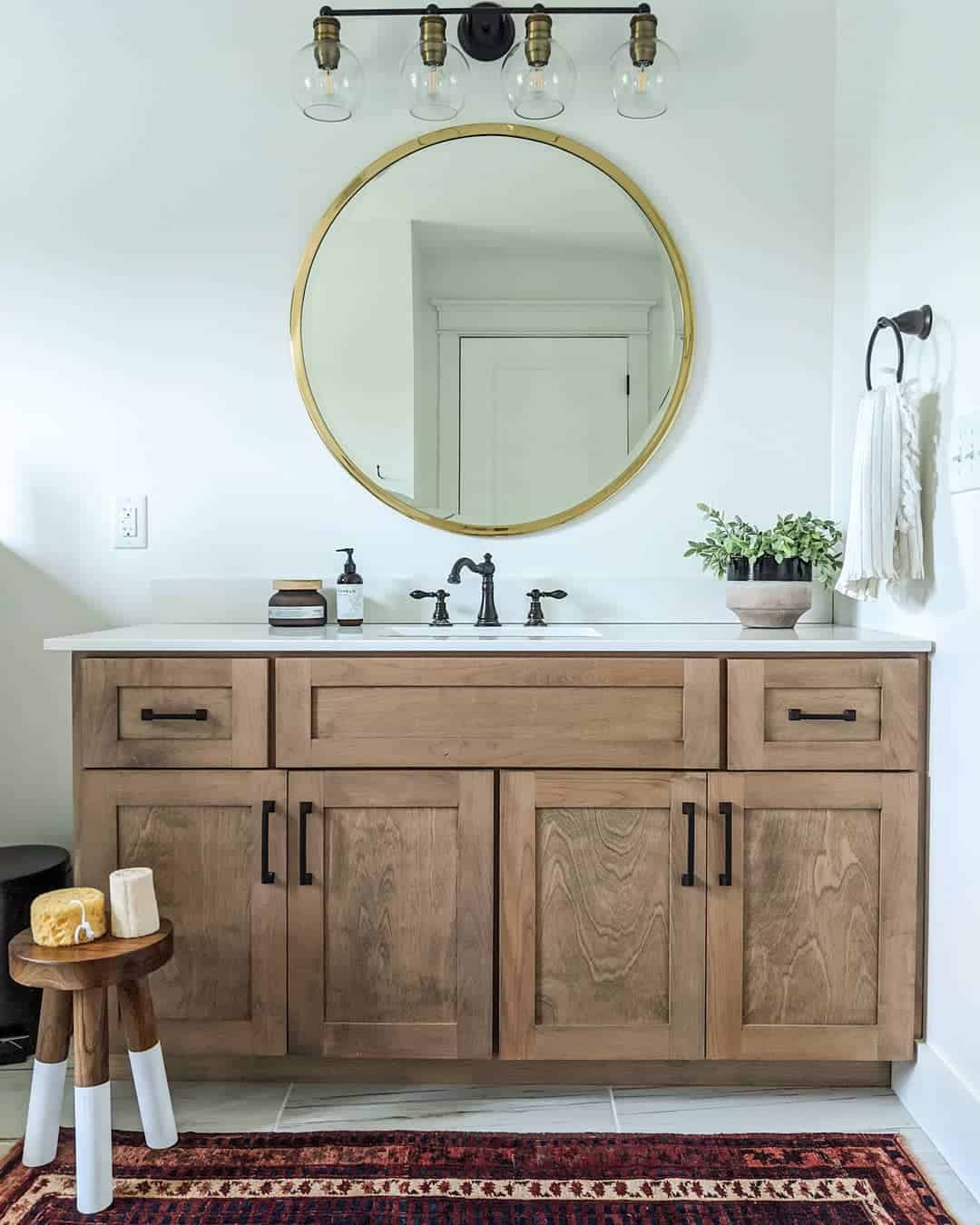 Soften Vanity Lines with a Round Brass Mirror