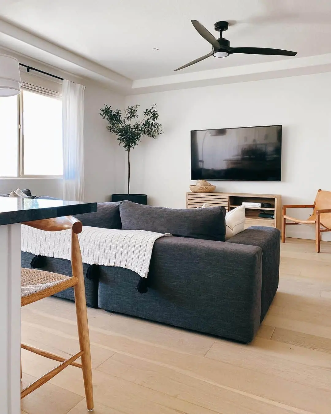 Layer a White Throw on a Charcoal Sofa