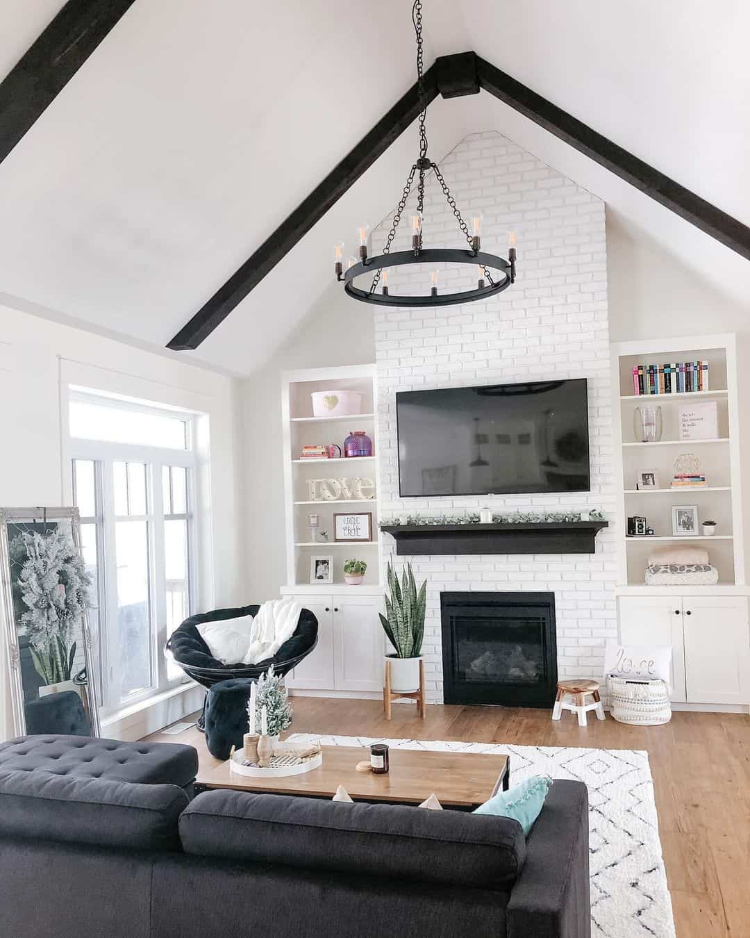 Exposed Black Beams Add Modern Drama to Vaulted Ceilings