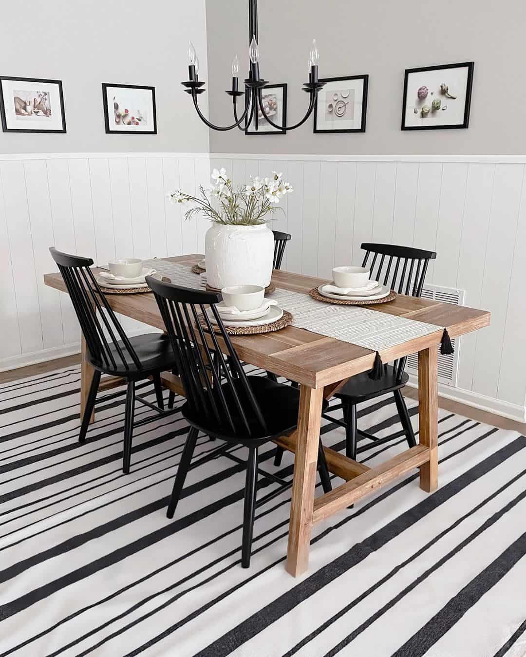 Bold Striped Rug Anchors a Black and White Dining Space