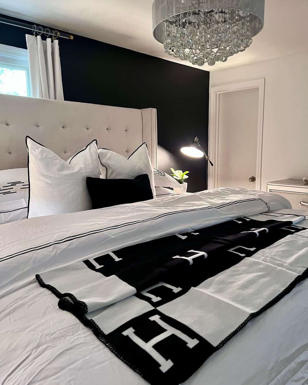 Bold Monogram Throw Adds Graphic Contrast to Crisp White Bedding