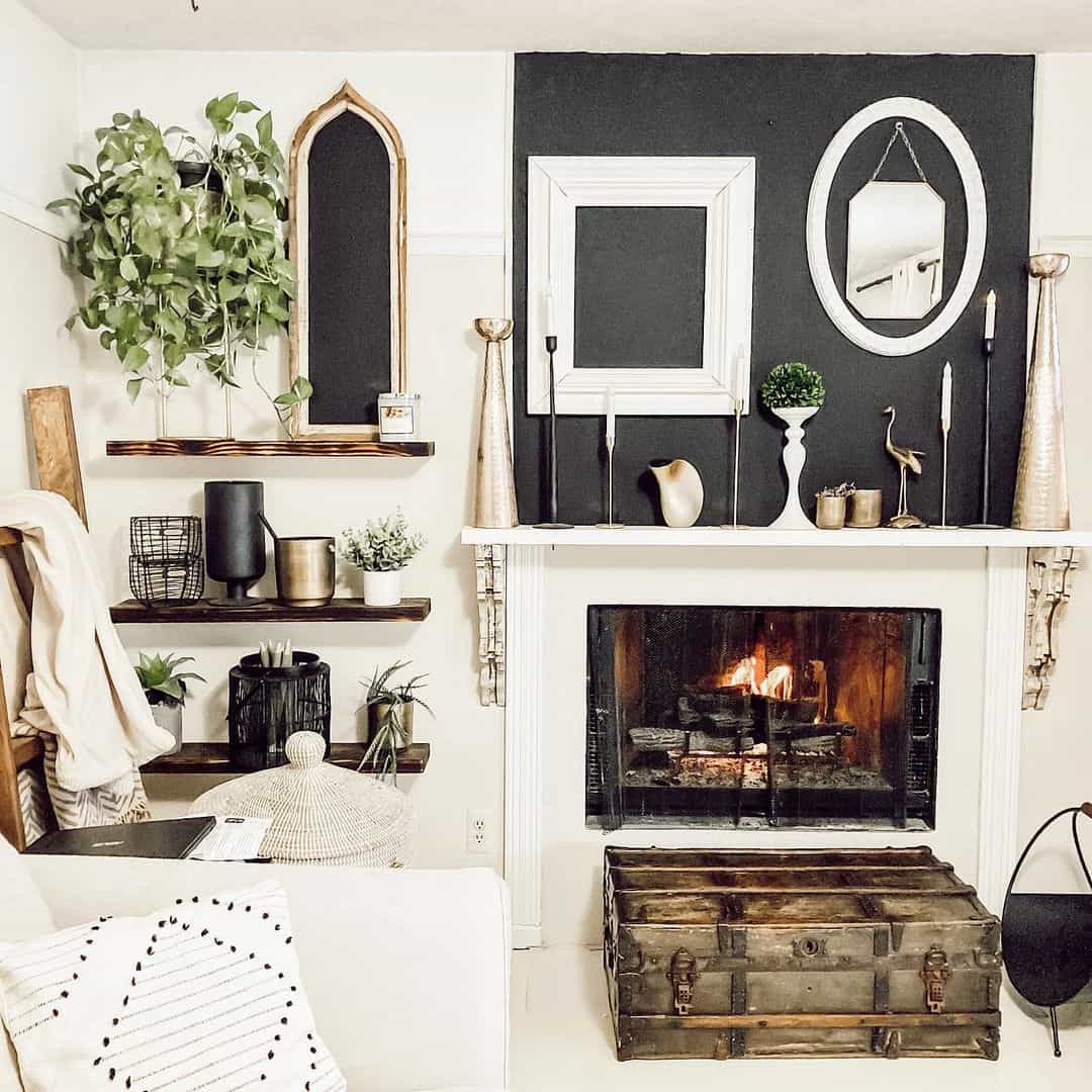 Layered White Frames Create a Striking Mantelpiece Focal Point