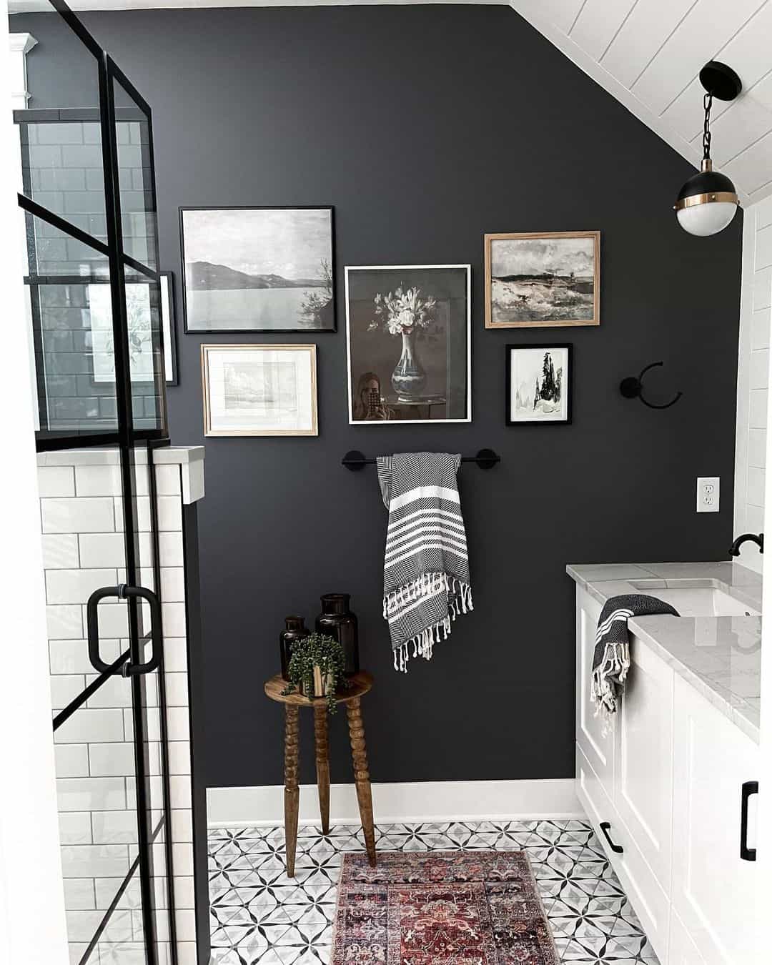 Gallery Wall of Black and White Art Adds Depth to Dark Walls
