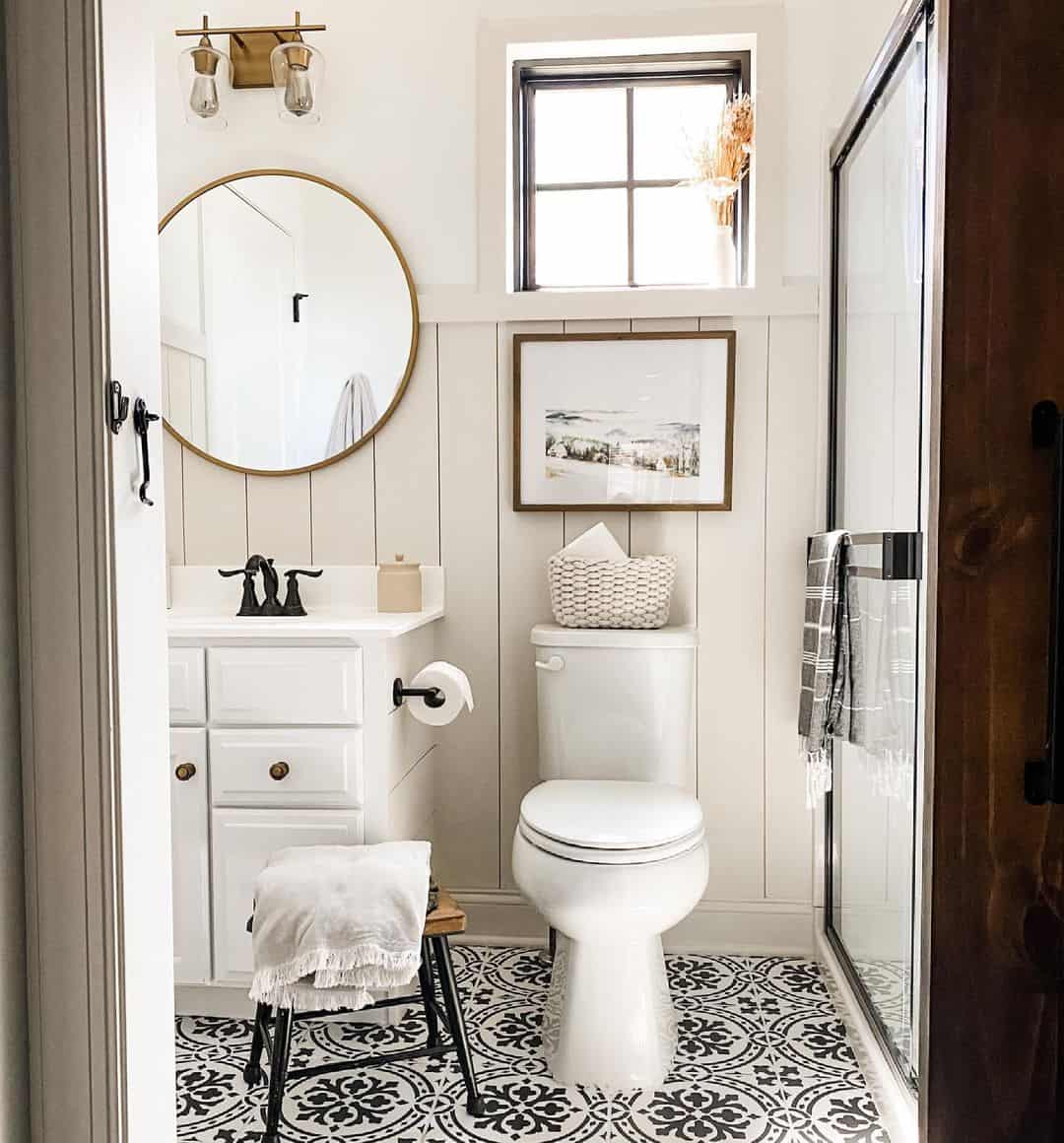 Reflect Light Above Your Vanity with a Round Gold Mirror