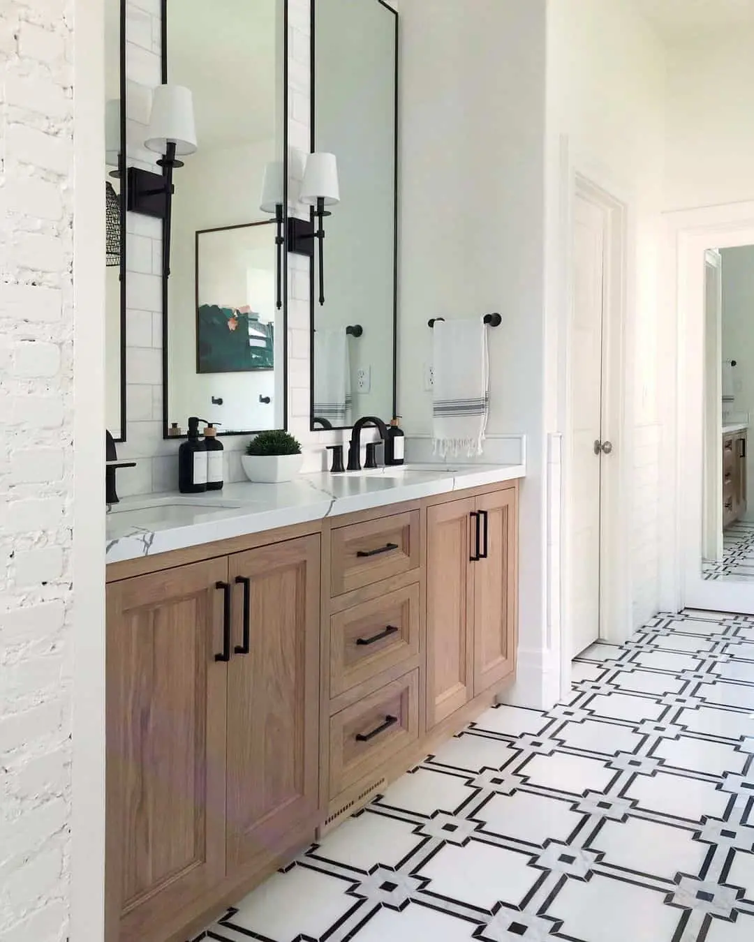 Frame Sconces Above Double Vanities with Tall, Narrow Mirrors