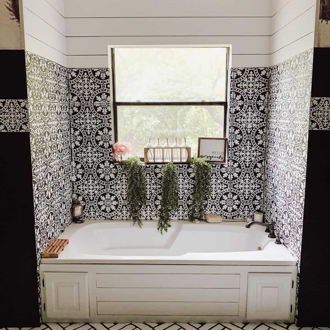 Patterned Tile Walls Create a Dramatic Backdrop for a Bathtub