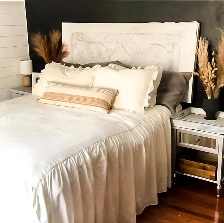 Textured White Headboard Softens Dark Walls