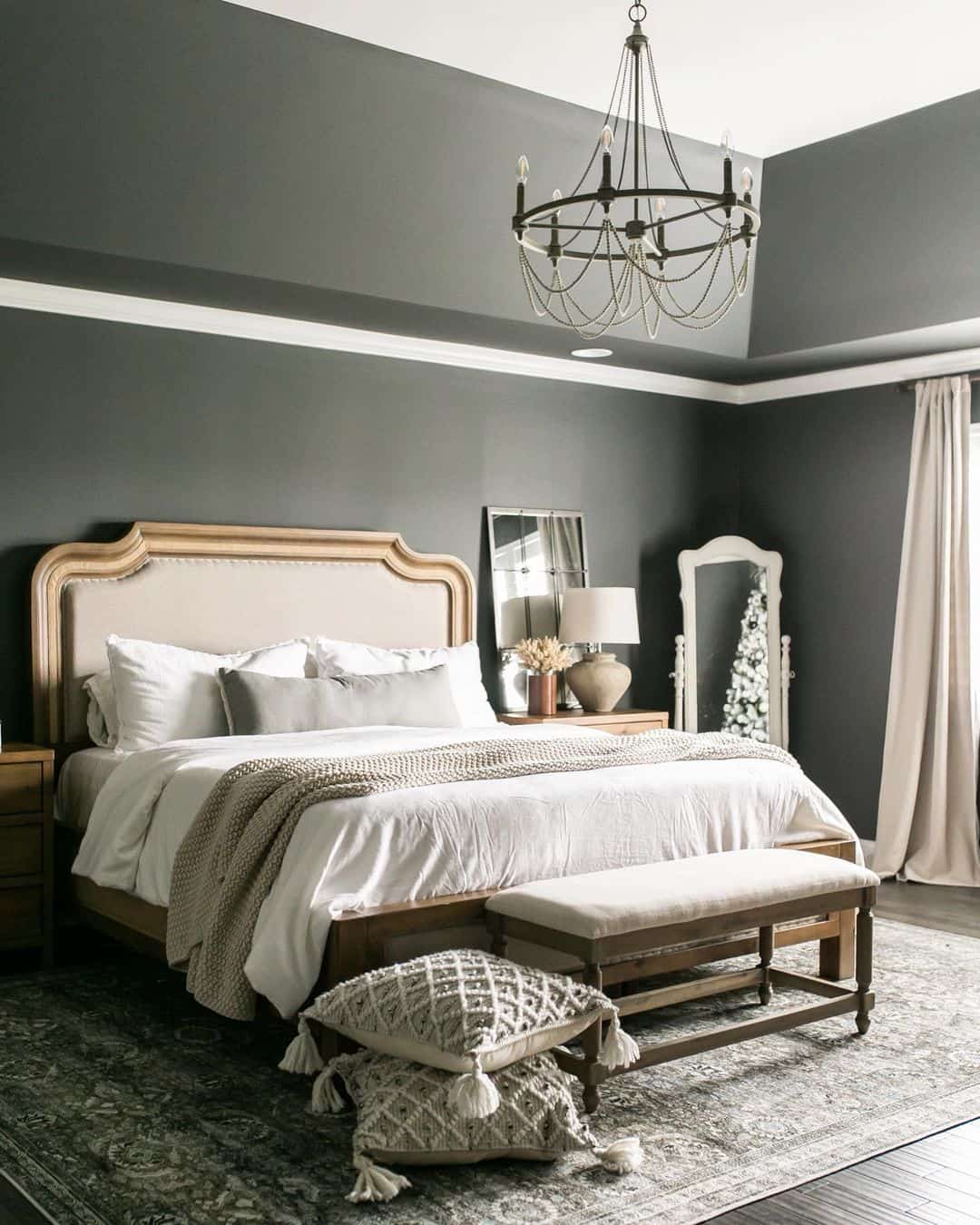 Curved Upholstered Headboard Softens Dark Walls