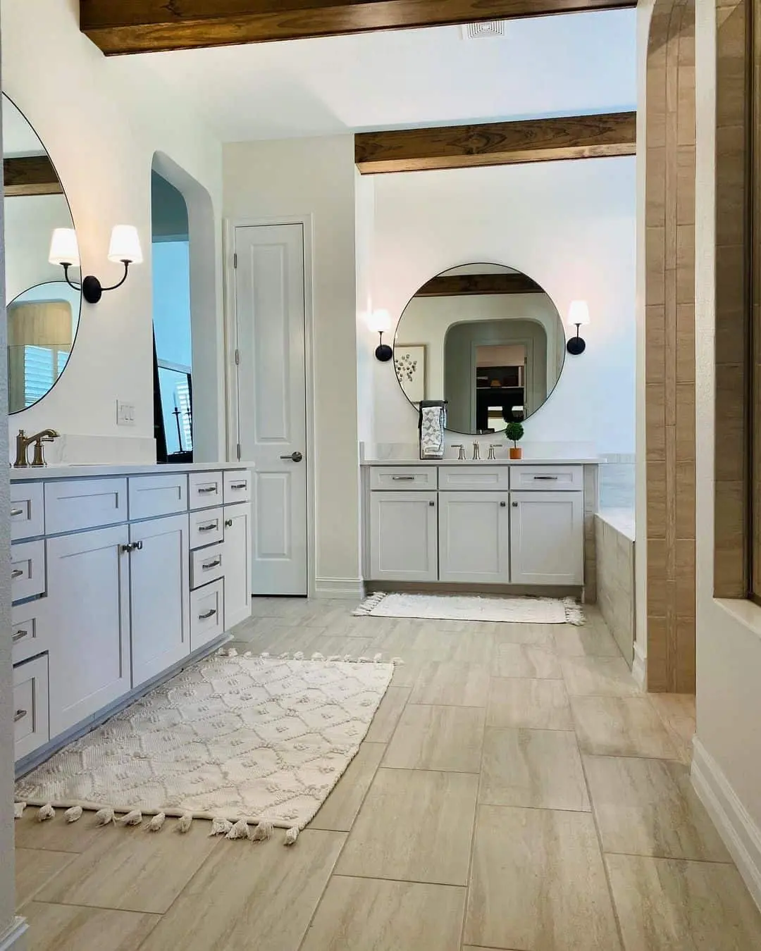 Large Round Mirrors with Simple Black Sconces