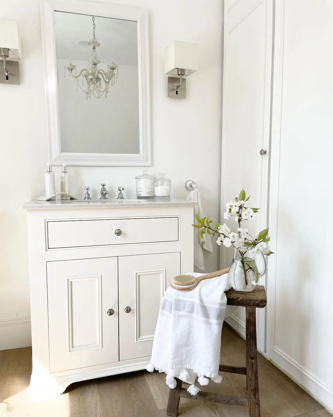 Classic Symmetry: Square Sconces Frame a Tall Rectangular Mirror