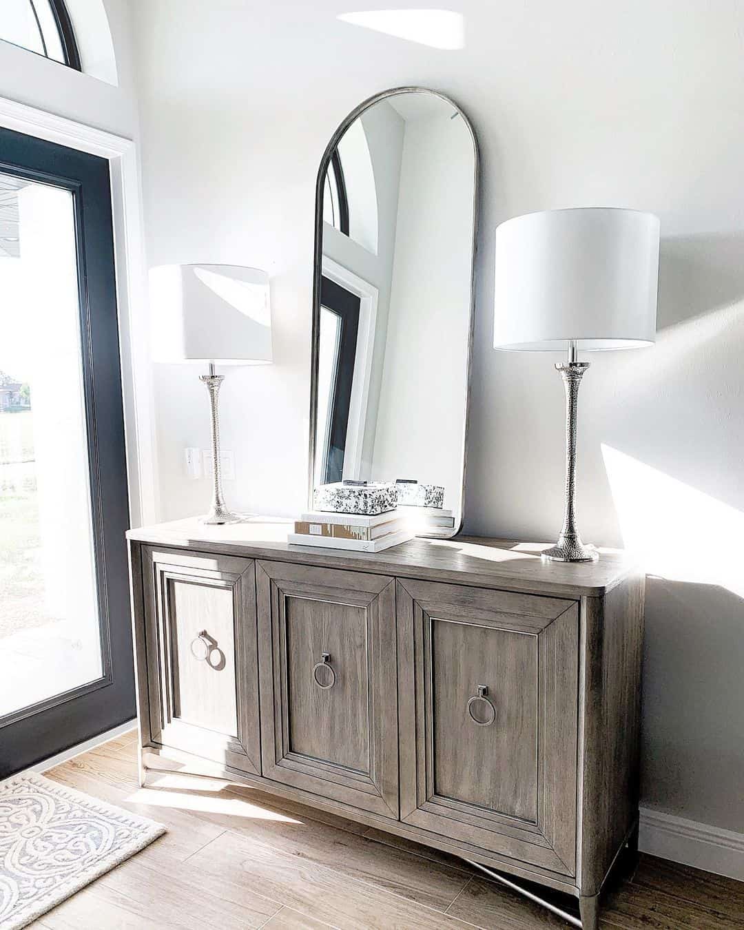 Tall Arch Mirror Adds Architectural Interest Above Console