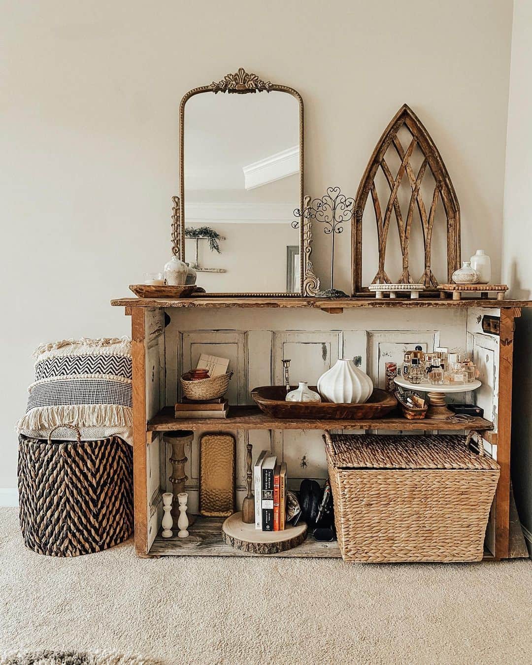 Ornate Mirror Reflects a Tiered Perfume Display