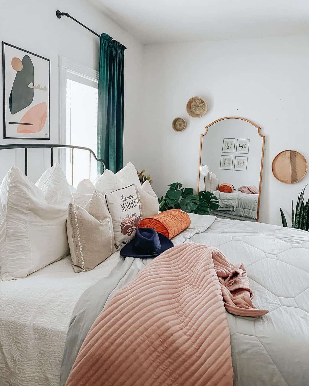Arched Mirror Frames a Cozy Bedside Scene