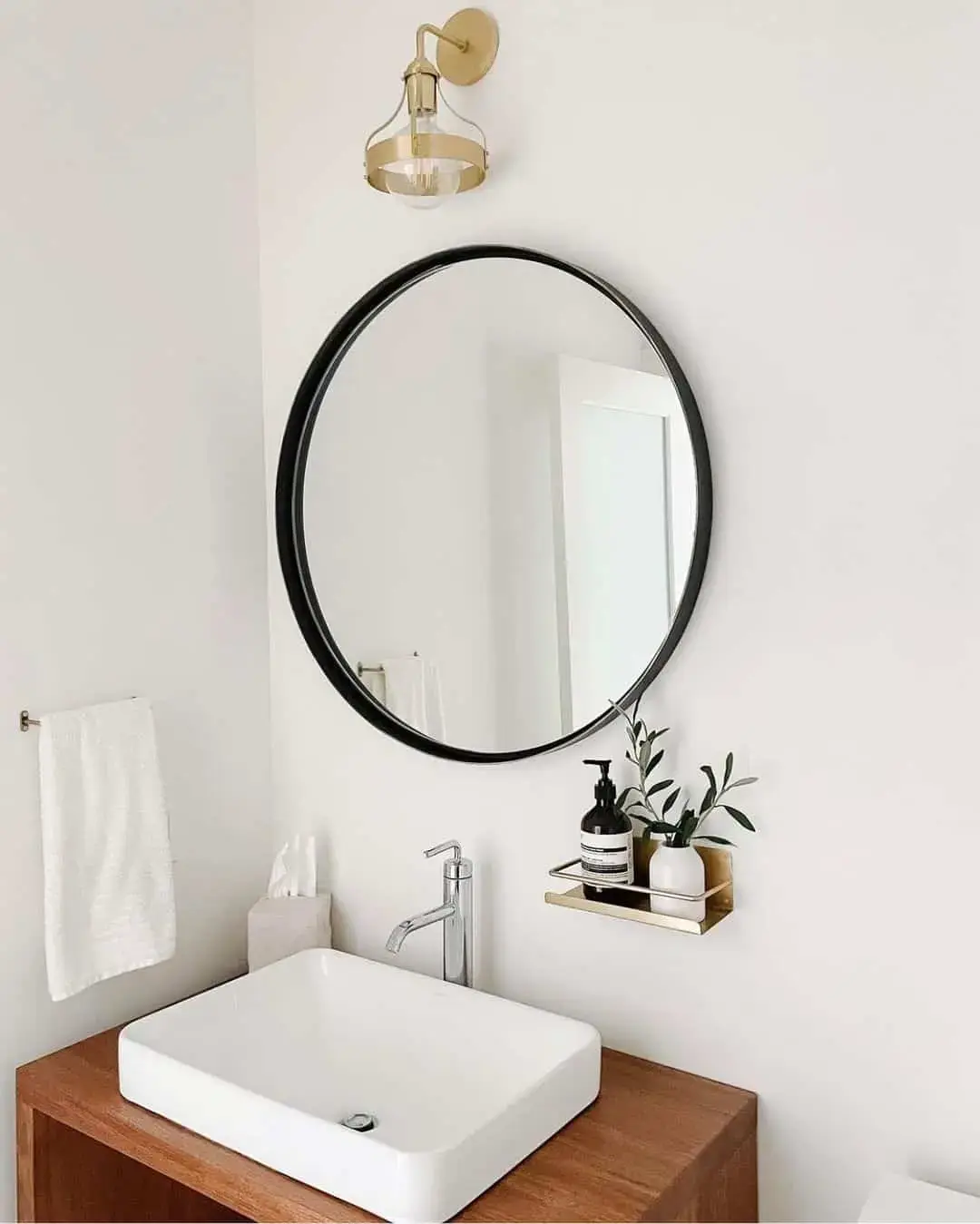 Slim Black Round Mirror for a Minimalist Vanity