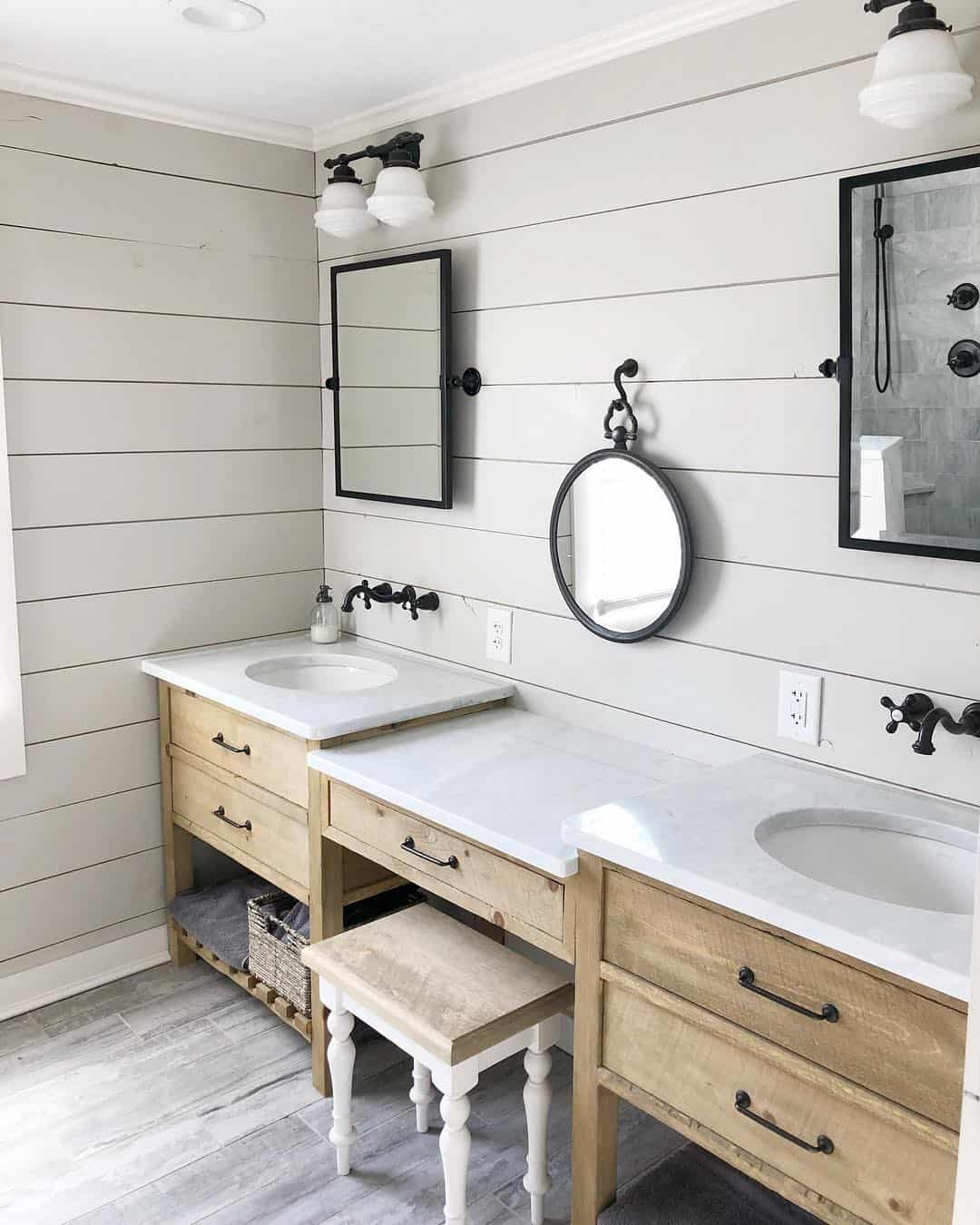 Tall Black Mirror Frames a Narrow Vanity with Open Shelving