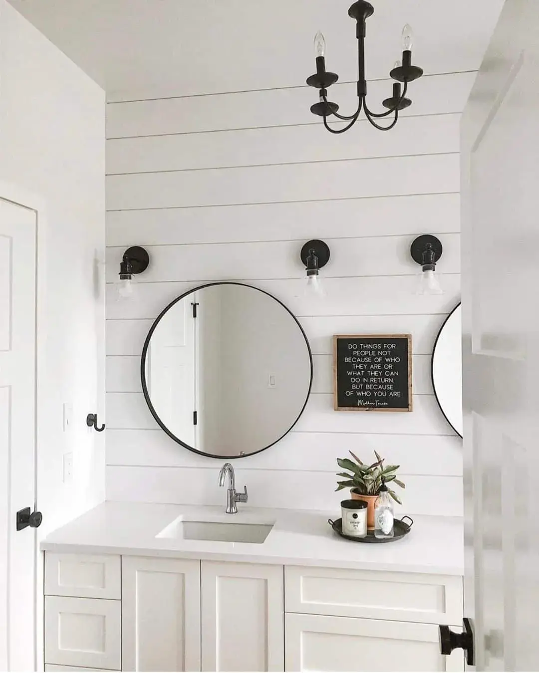 Pair of Round Black Mirrors Frame a Shiplap Vanity