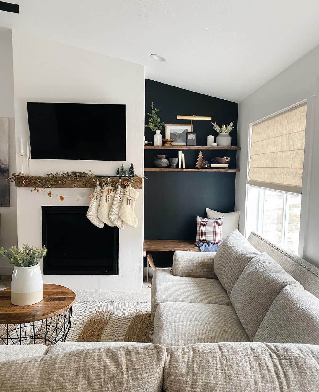 Dark Accent Wall Creates a Cozy Nook for Shelving and Seating