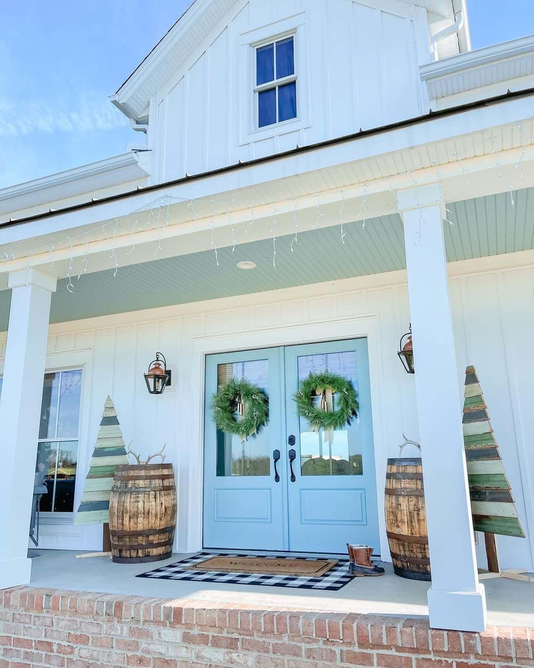 Rustic Charm with Wooden Barrels Beside Blue Doors