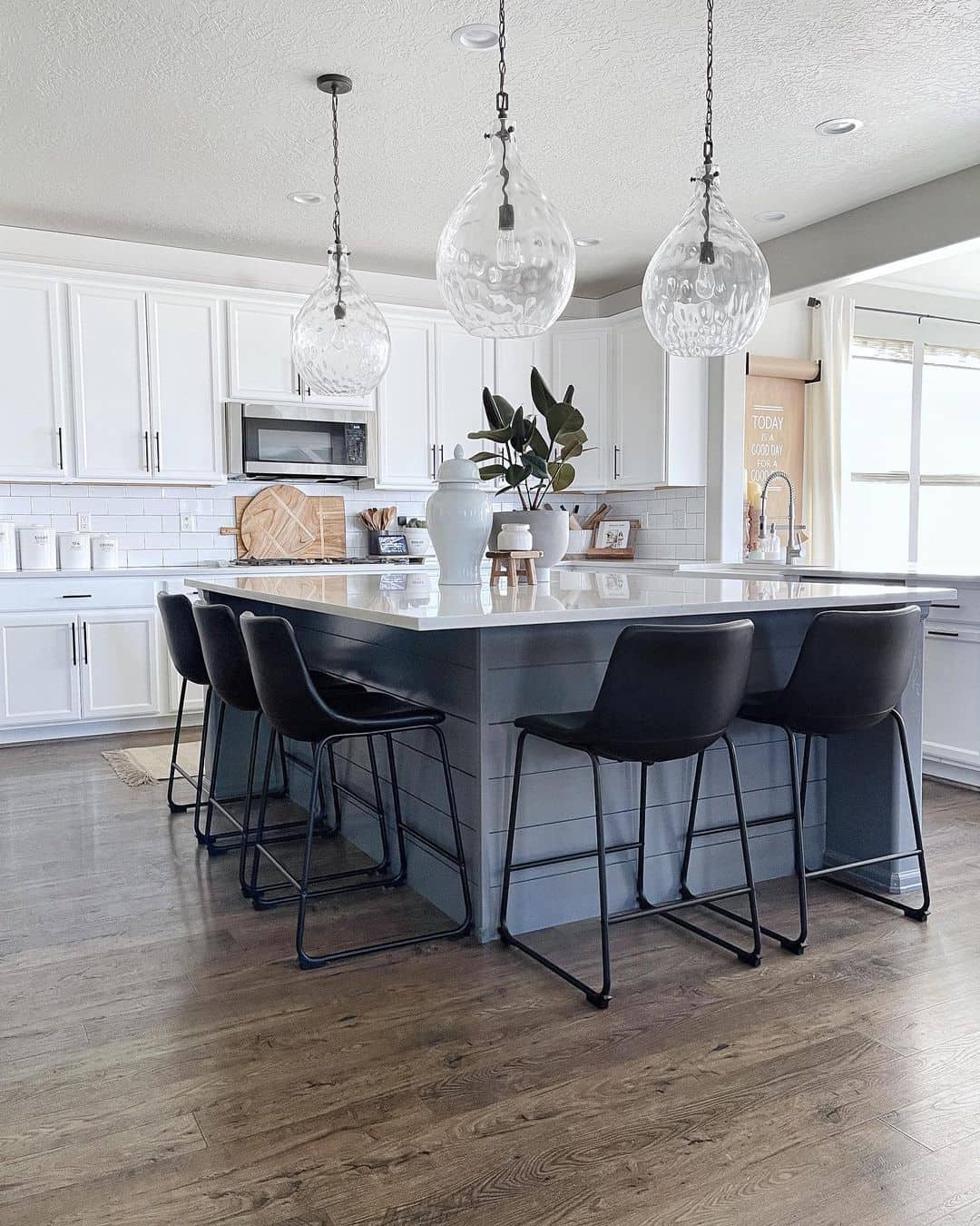 Gray Shiplap Island with Modern Black Stools