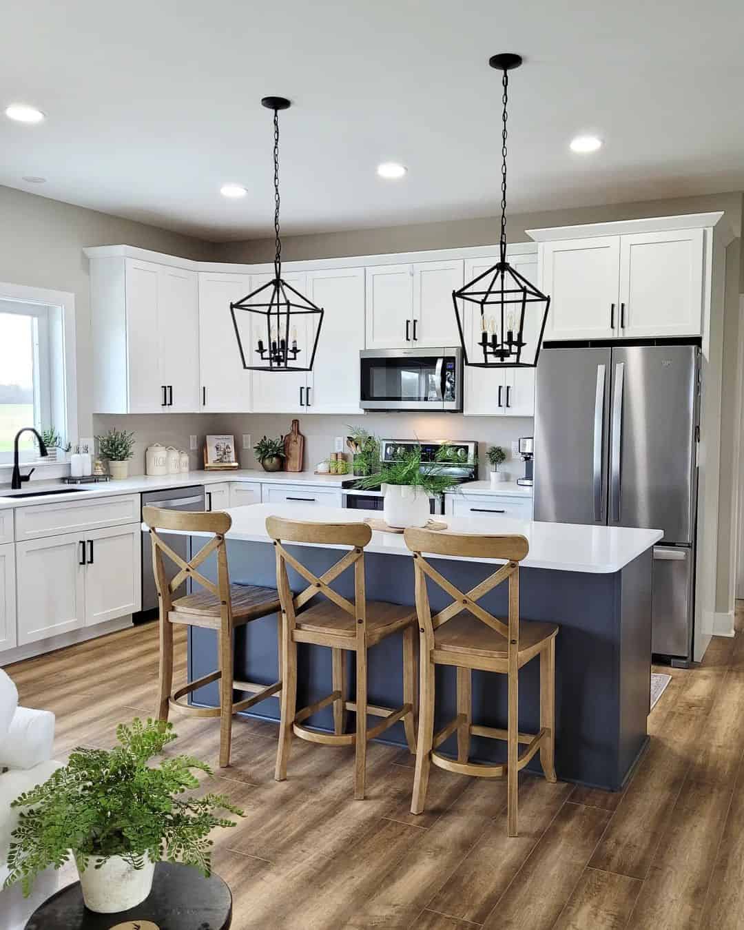 Dark Blue Island with White Countertop and Wood Stools