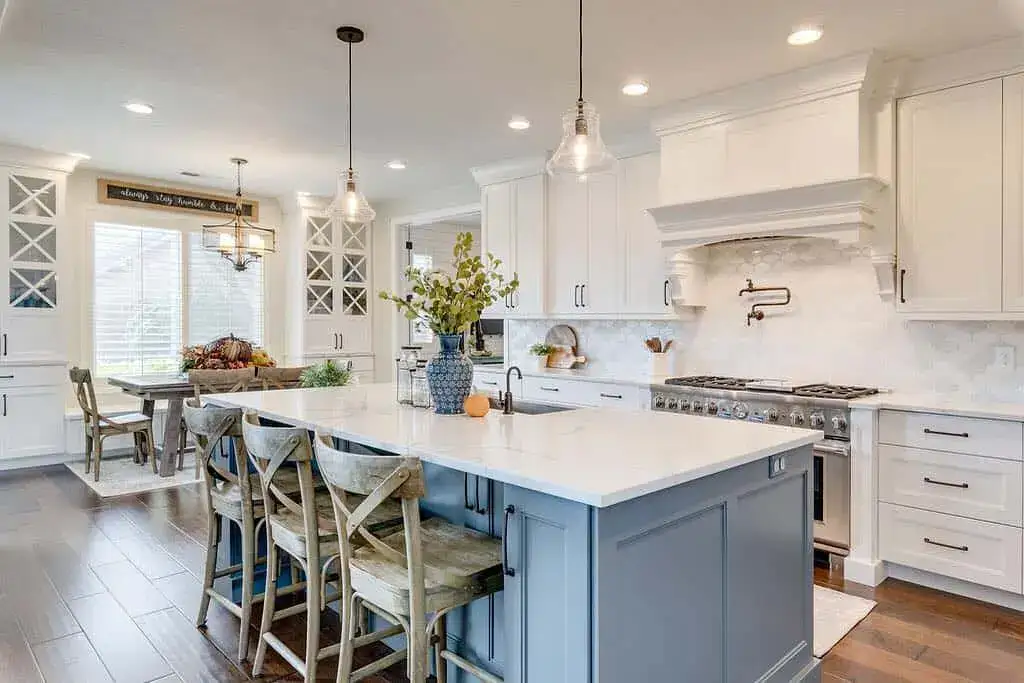 Soft Grey-Blue Island with Paneled Doors and White Quartz Top