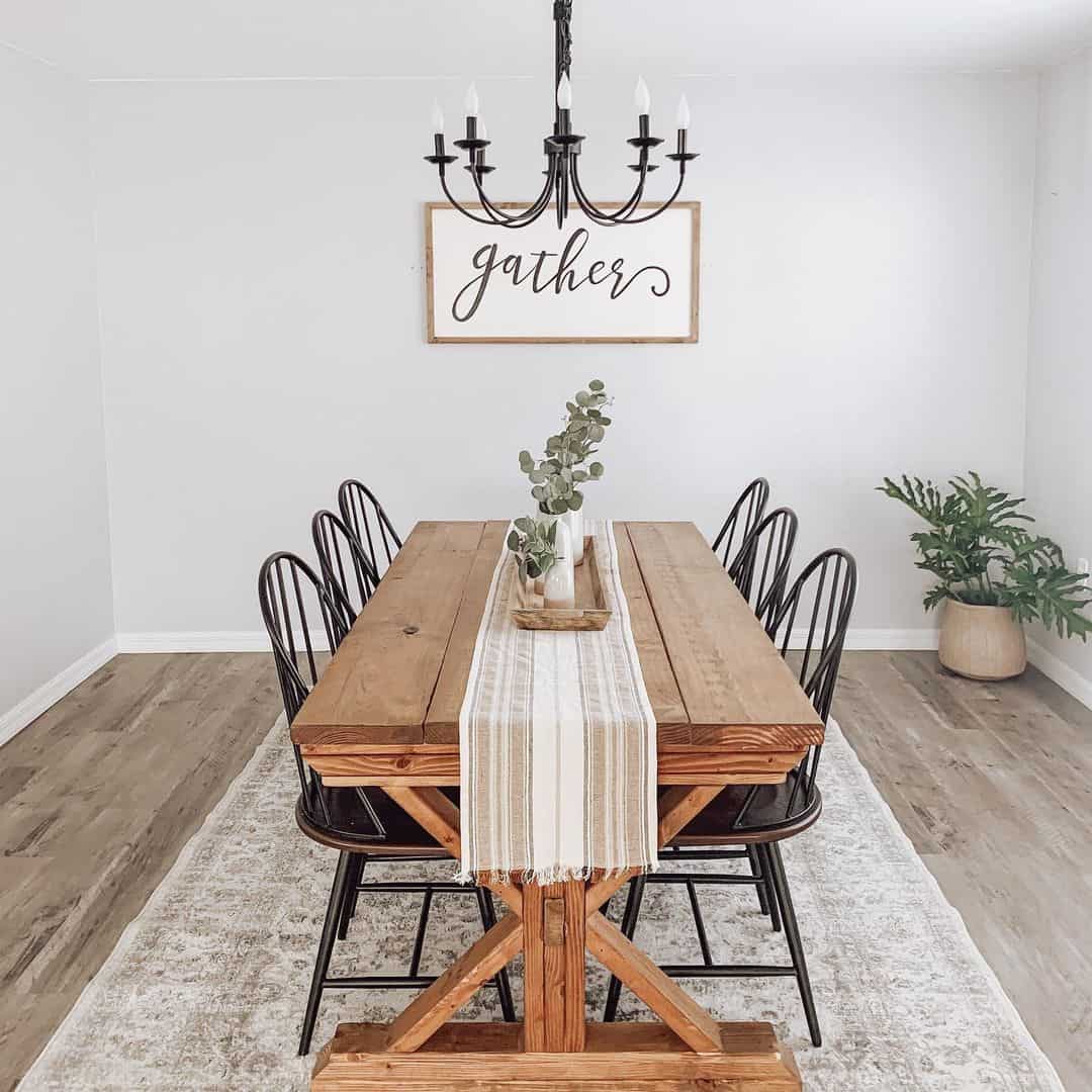 Black Candlestick Chandelier Anchors Rustic Table