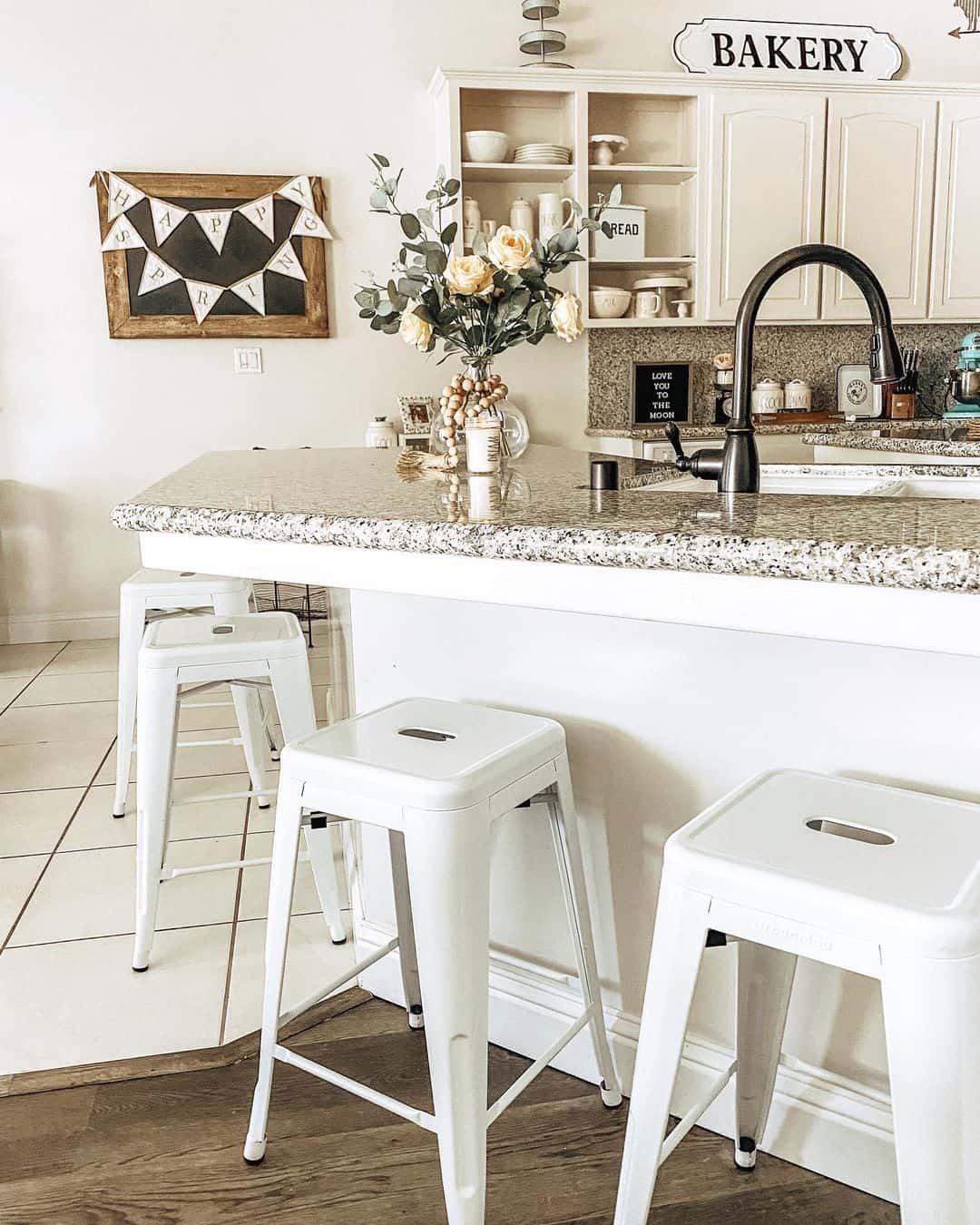 White Stools Add a Clean, Modern Touch to Island Seating