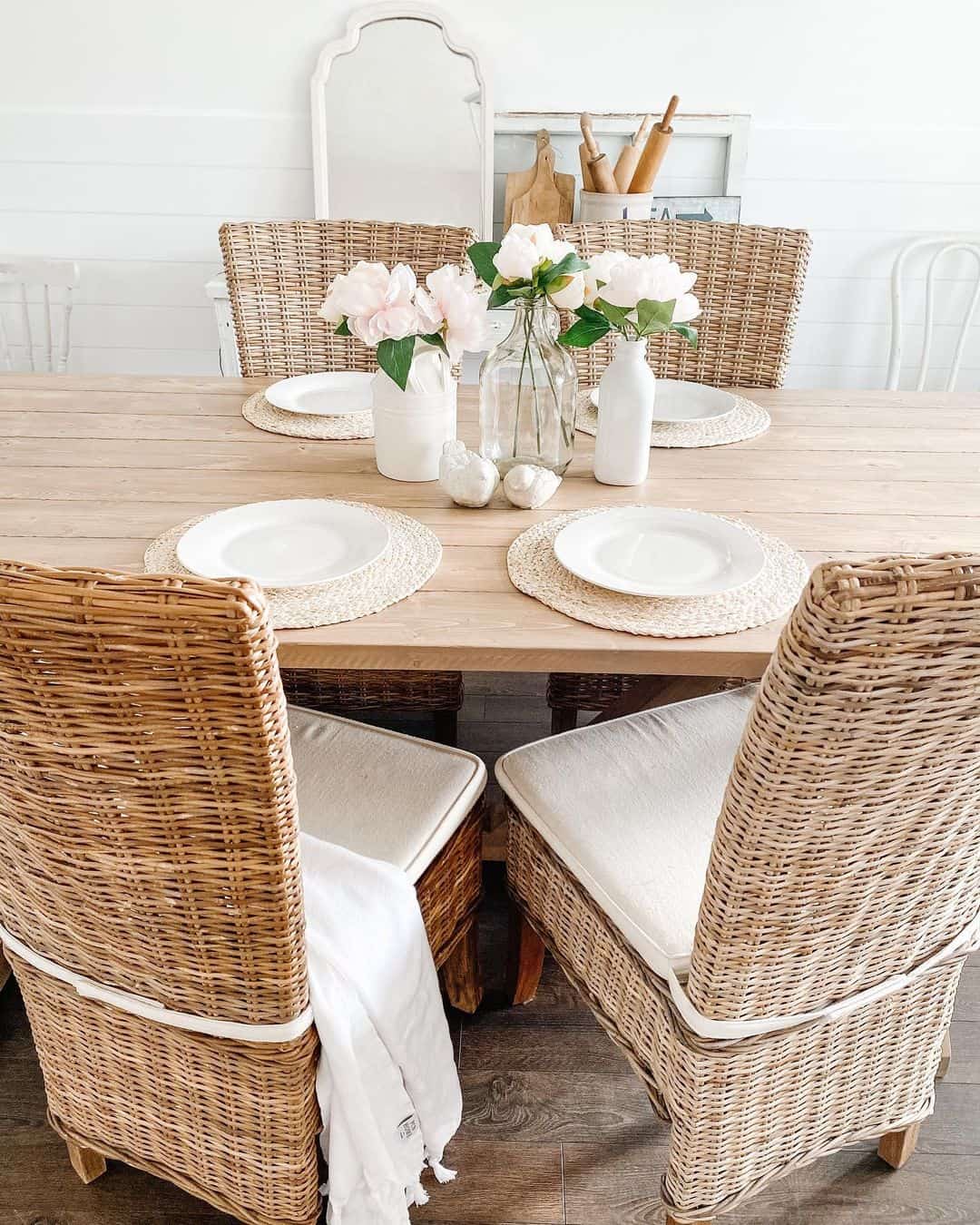 White Ceramic Vases Hold Delicate Peonies and Greenery