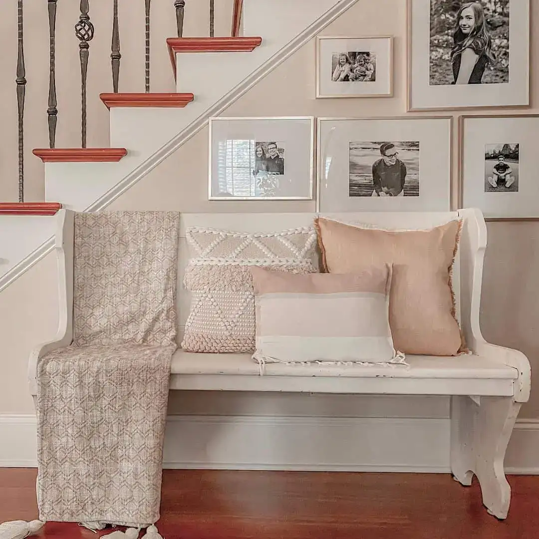 Gallery Wall Above Bench Creates a Cozy Nook