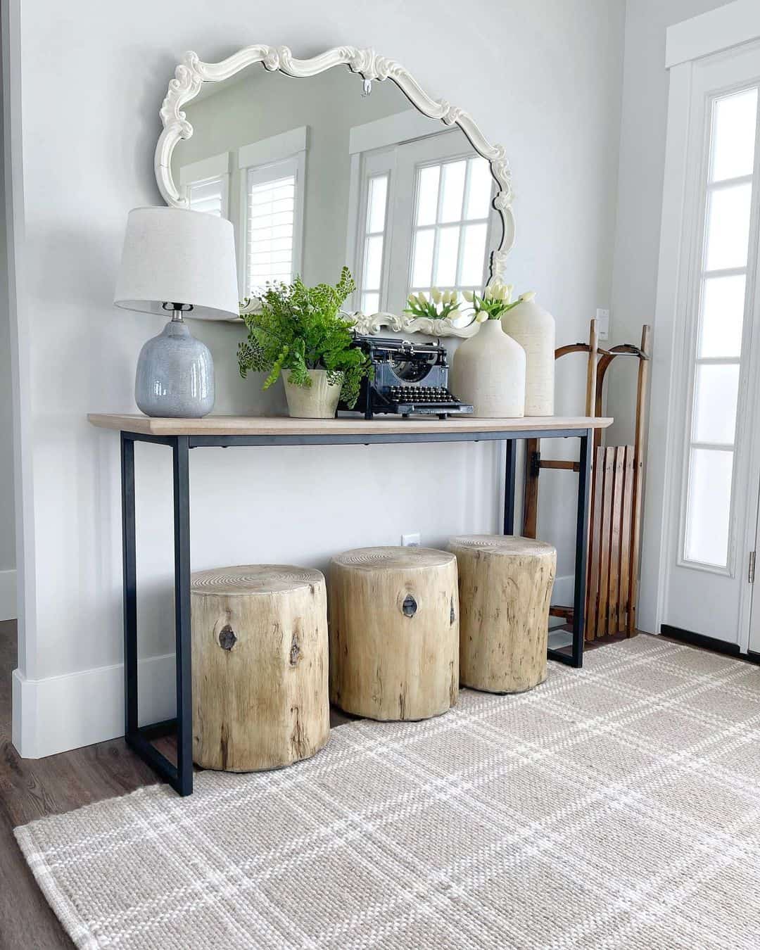 Vintage Flair: Ornate White Mirror Above Console