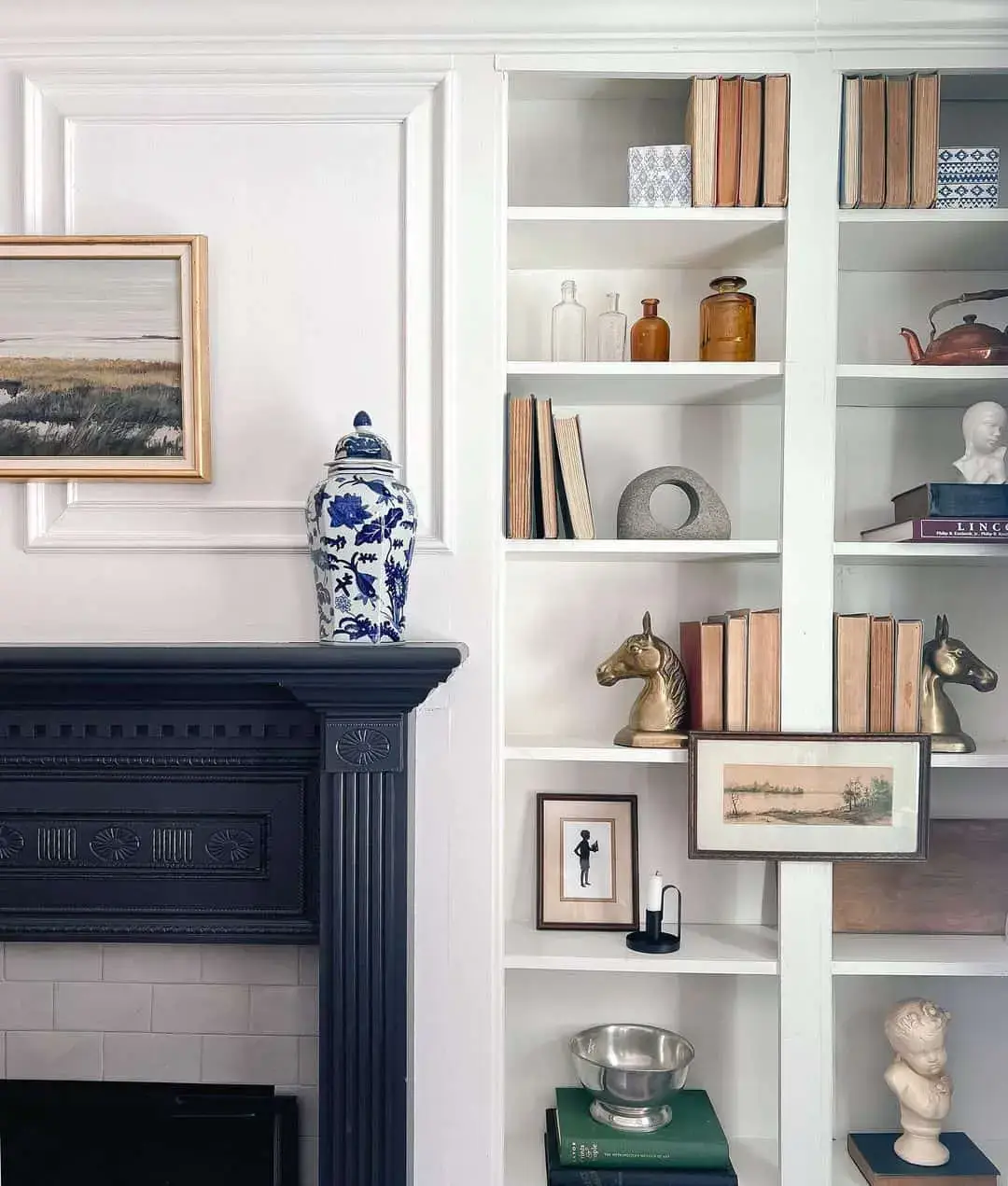Center a Dark Mantel with a Blue and White Ginger Jar