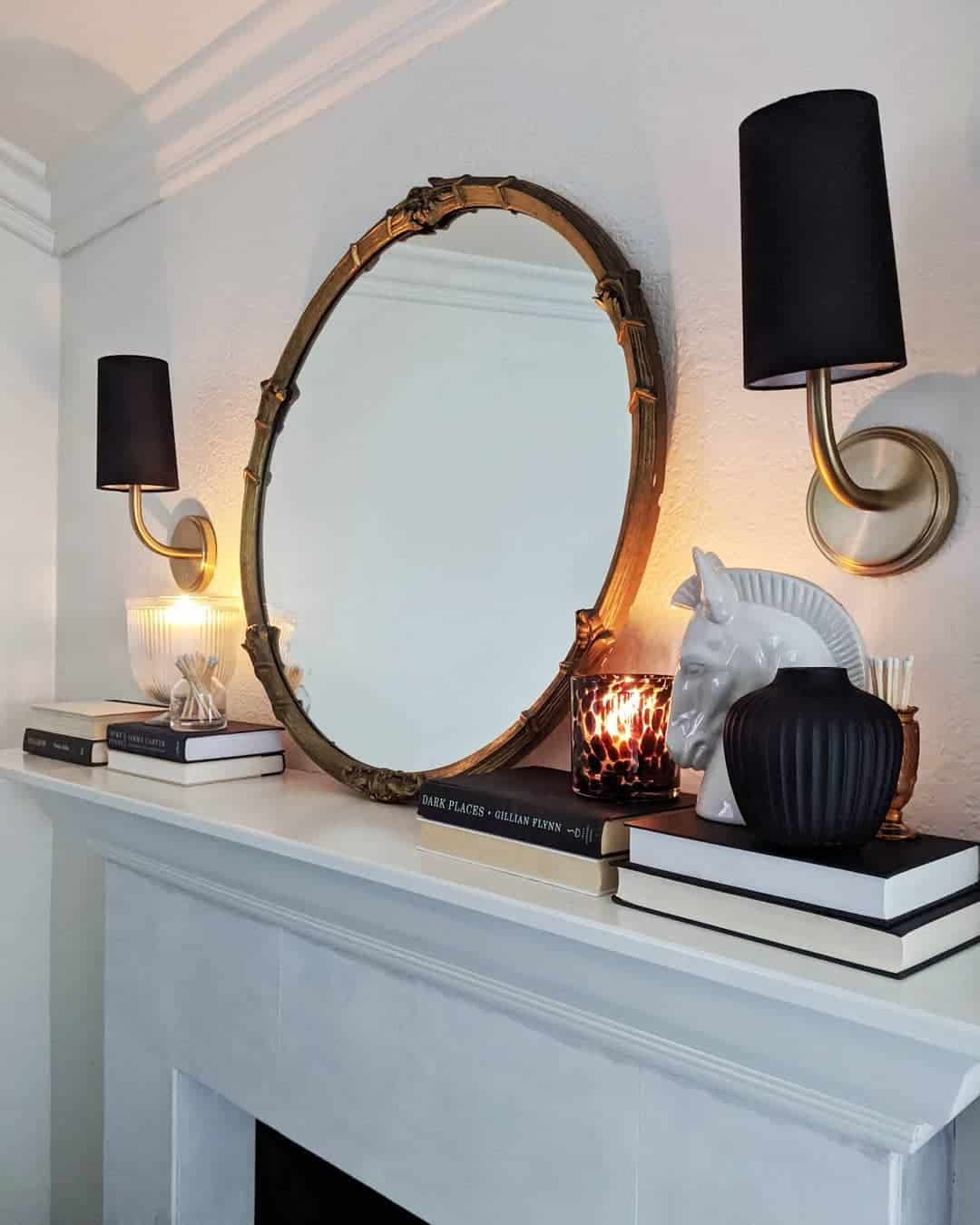 Flank an Oval Mirror with Black Sconces for Drama