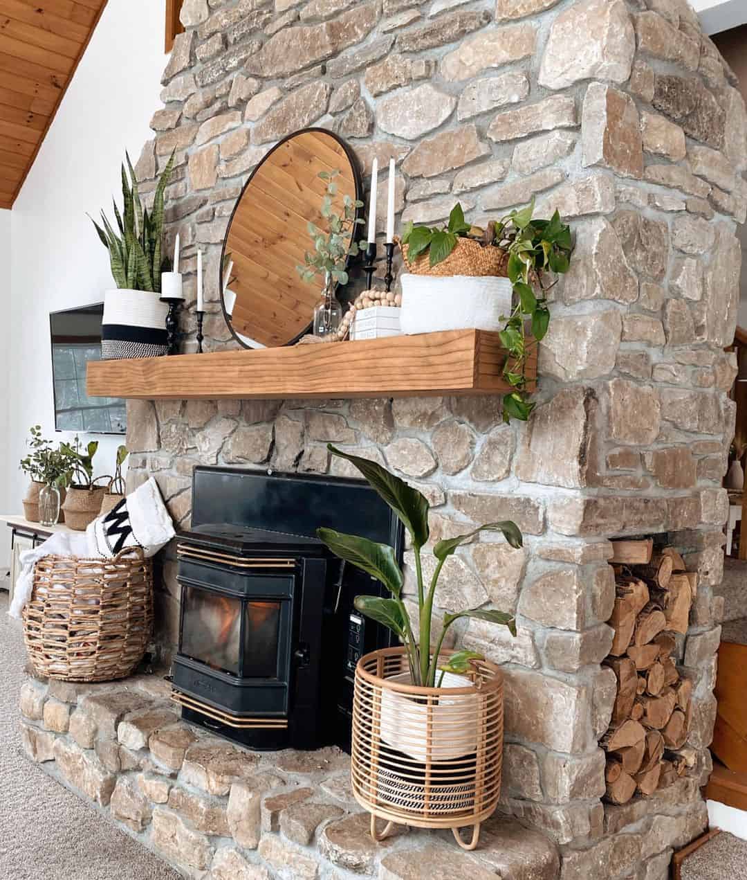 Oval Wood-Backed Mirror Adds Rustic Charm to Stone Mantel