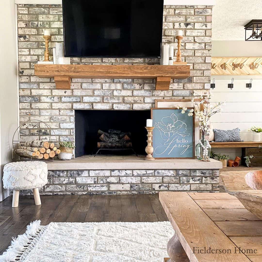 Whitewashed Brick Fireplace with Deep Wood Mantel