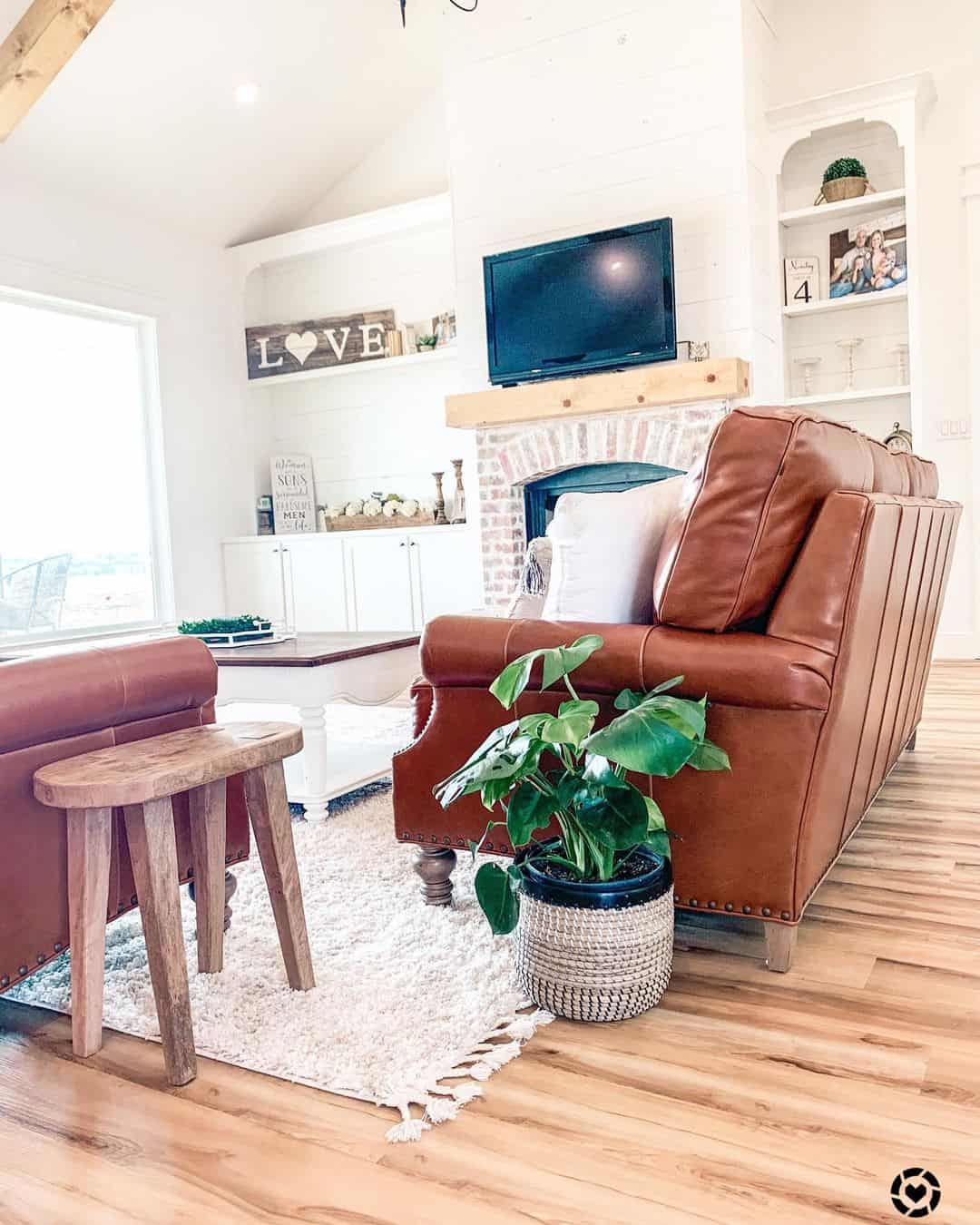 Layered White Rug Grounds Seating Area with Tasseled Edges