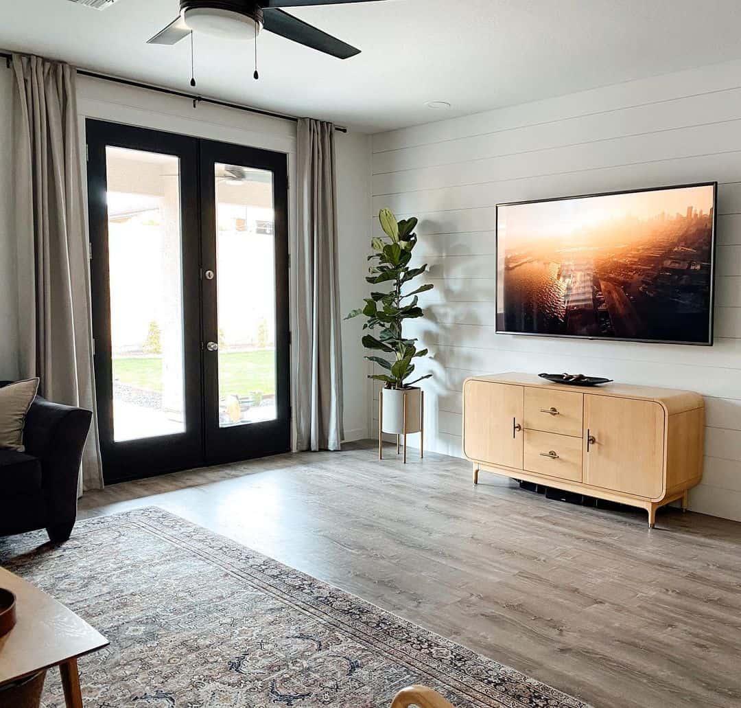 Neutral Floor-to-Ceiling Drapes Soften a Modern Living Space