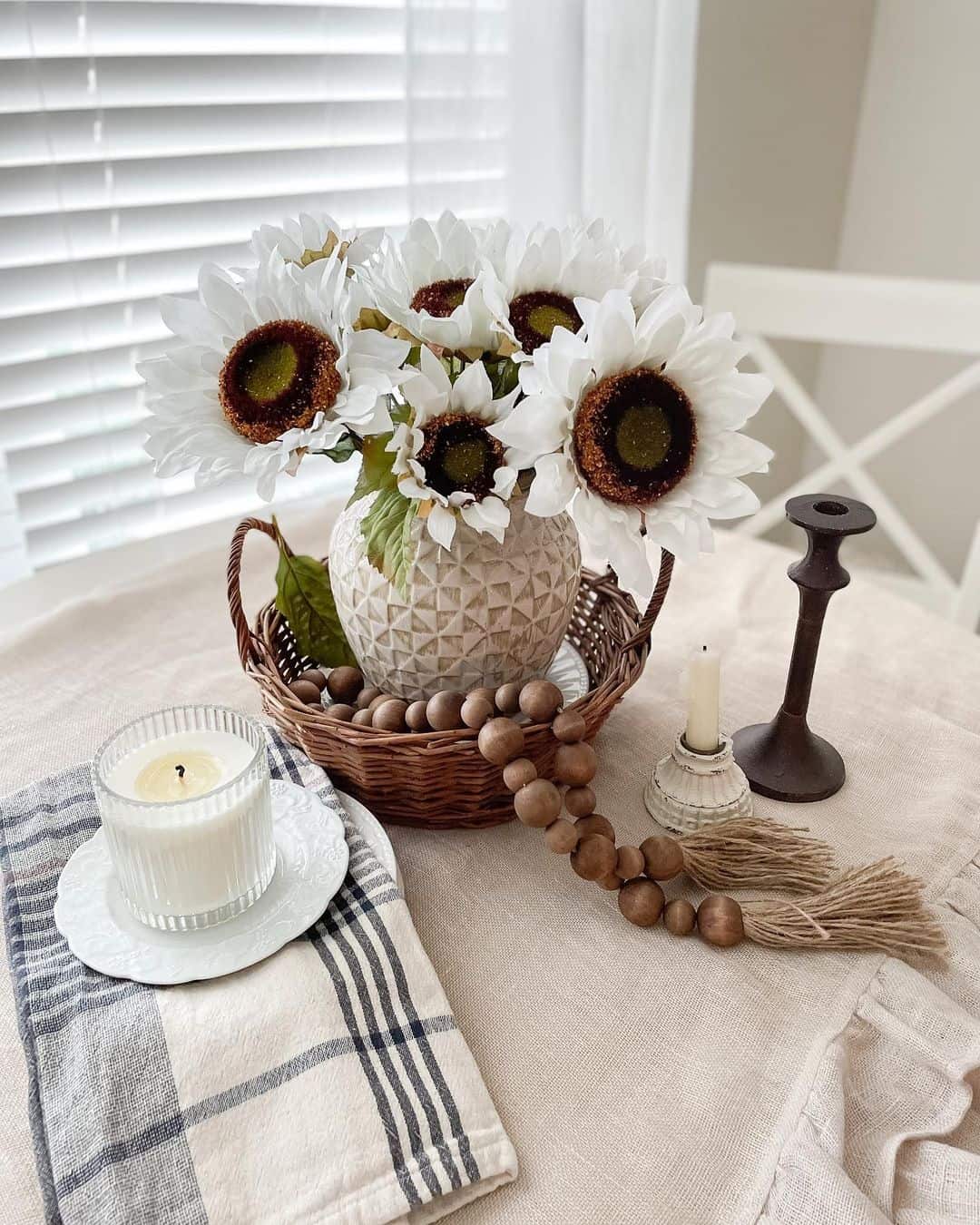 Textured Vase Holds White Sunflowers and Greenery
