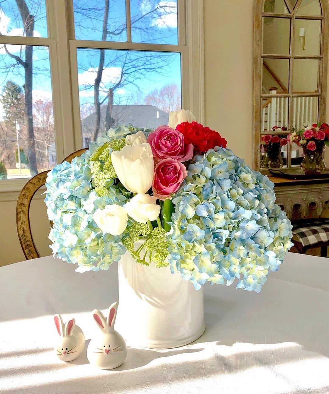 White Cylinder Vase Anchors Abundant Blue Hydrangeas