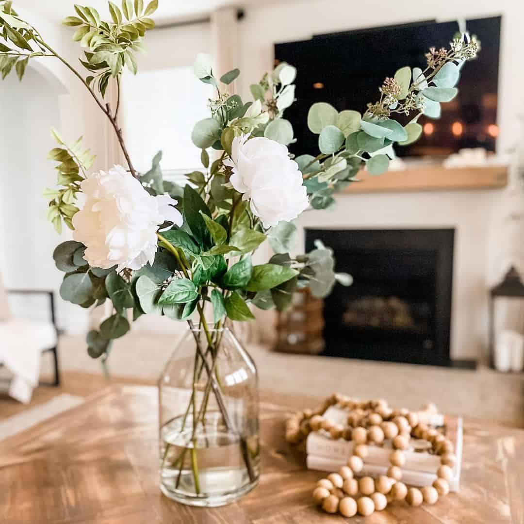 Tall Glass Vase Showcases White Peonies and Eucalyptus