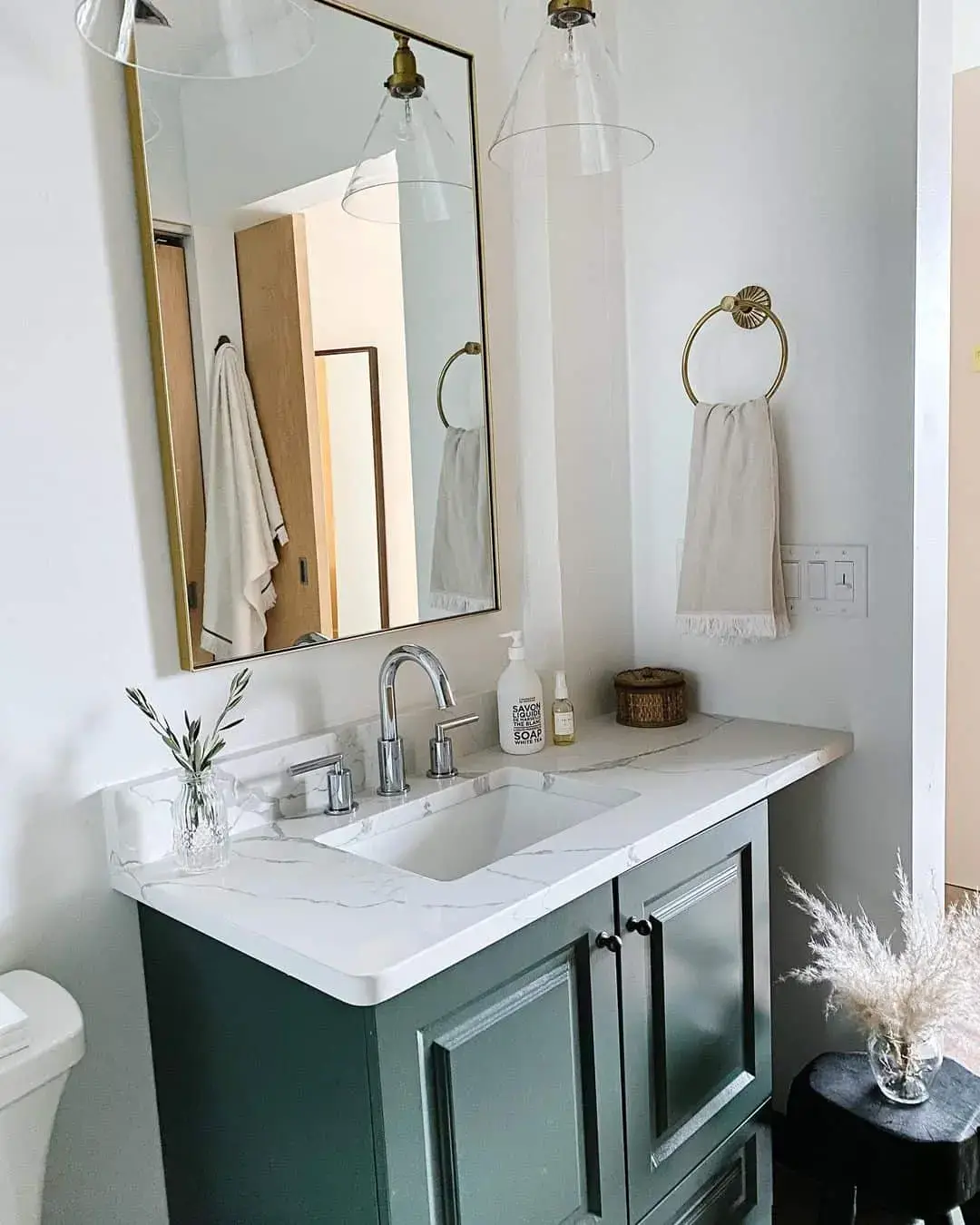 Deep Green Vanity With Black Cabinet Pulls Adds a Moody Contrast