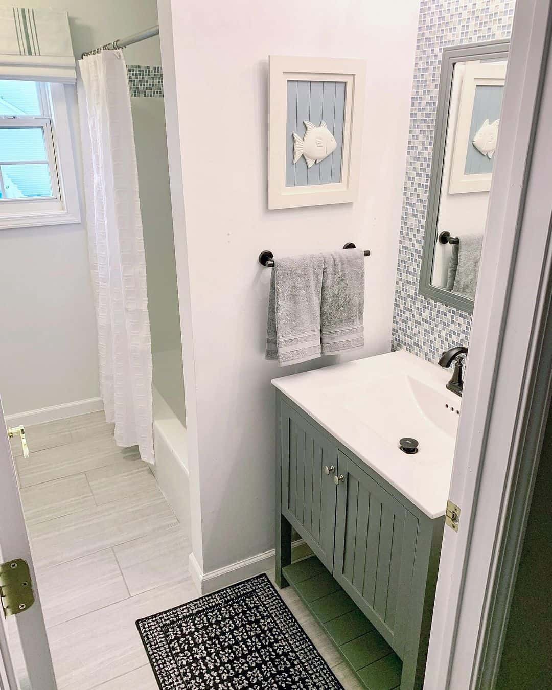 Green Vanity With Vertical Slats Adds a Coastal Vibe