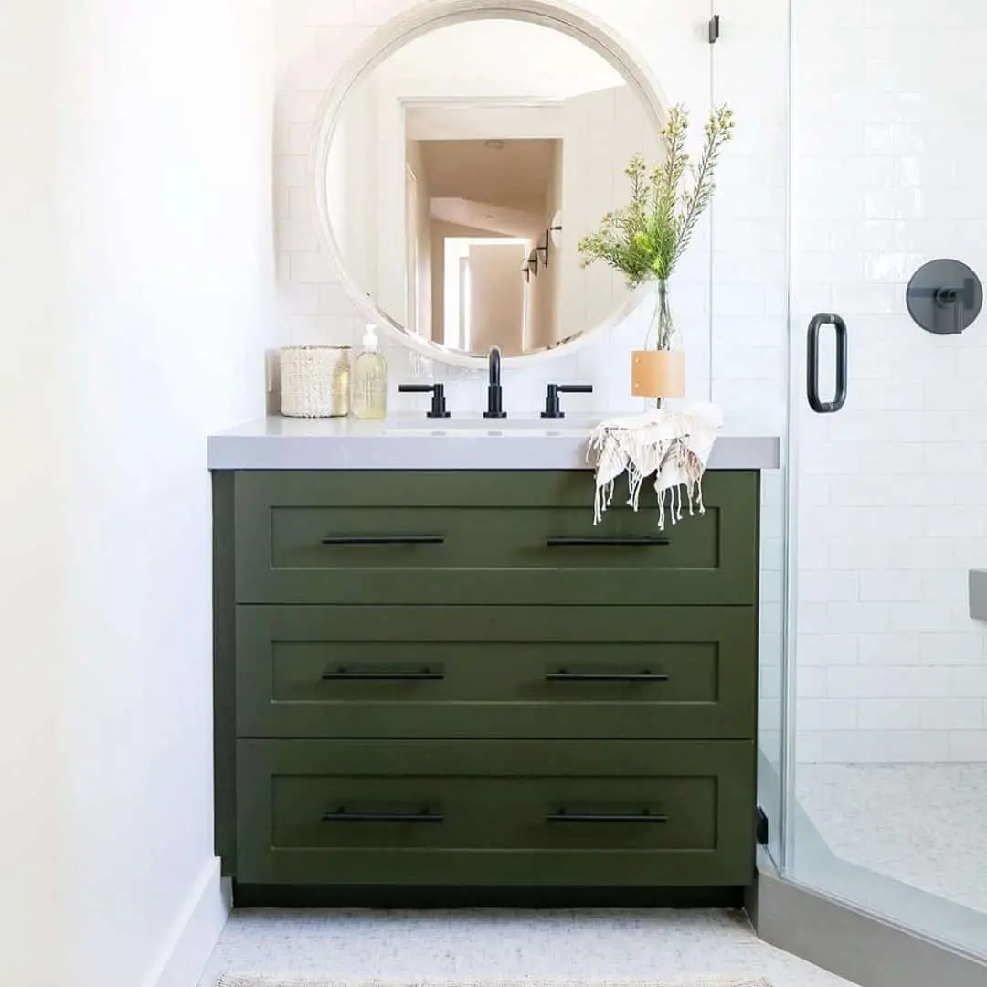 Deep Green Vanity With Clean-Lined Drawers and Black Hardware
