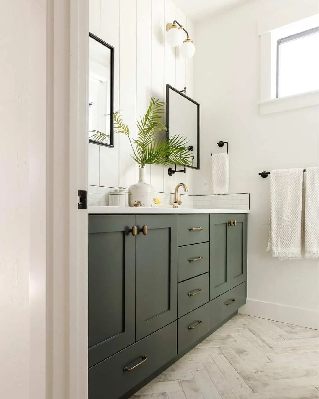 Deep Green Vanity With Brass Hardware Adds a Sophisticated Touch