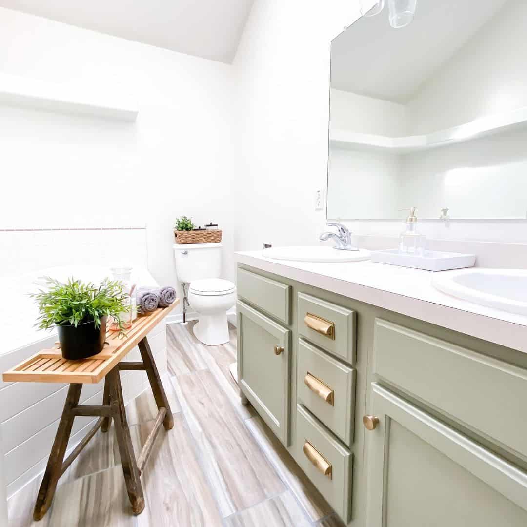 Sage Green Vanity With Brass Drawer Pulls Adds Warm Accents