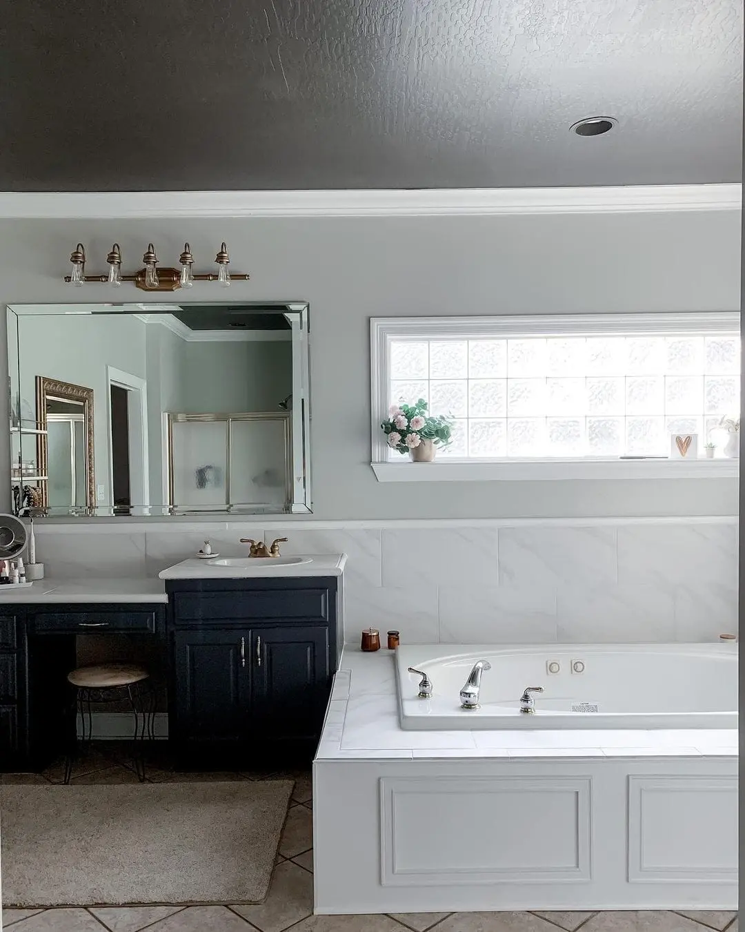 Define the Bathtub Base with White Wainscoting