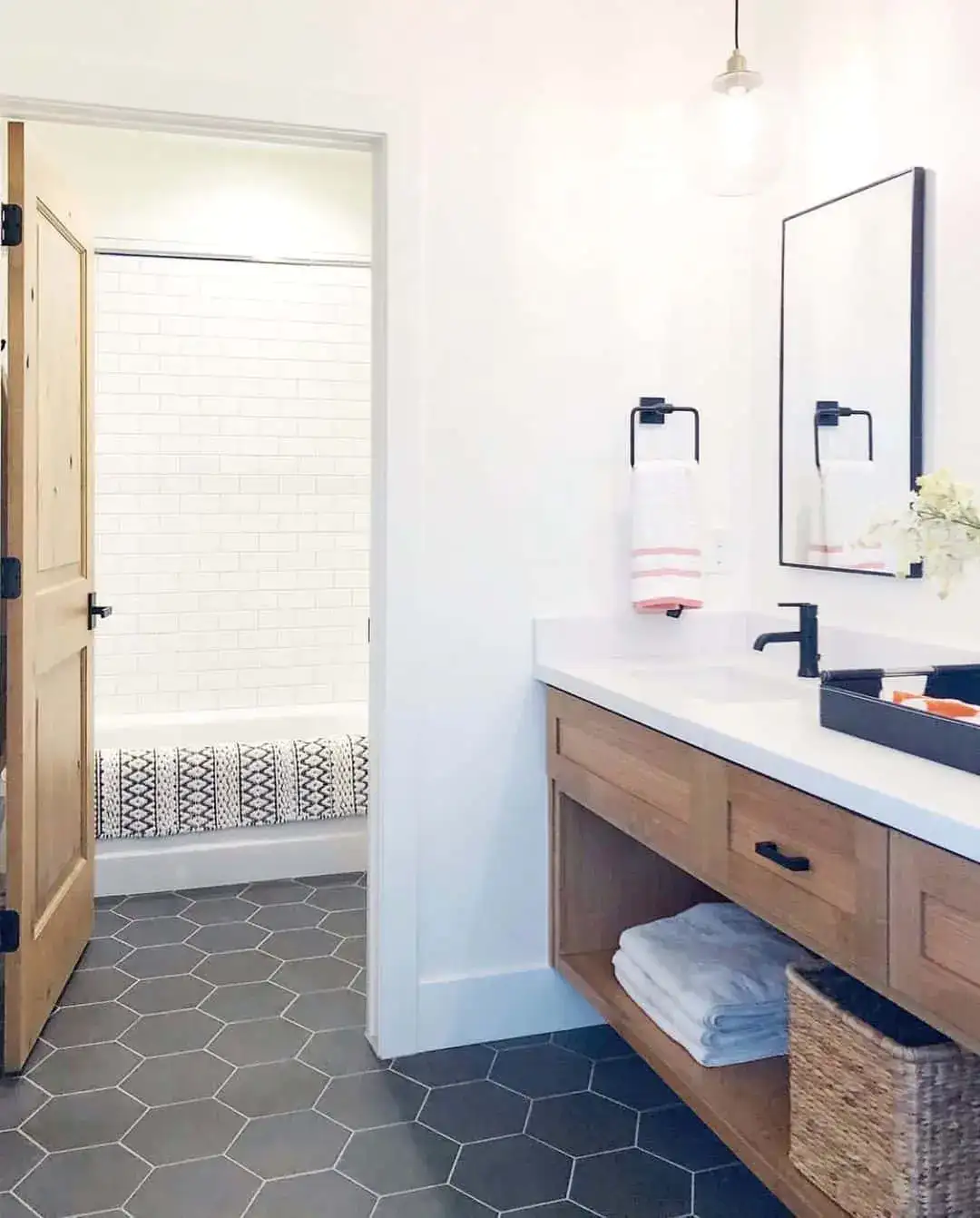 Textured Bath Mat Adds Pattern To White Subway Tile Shower