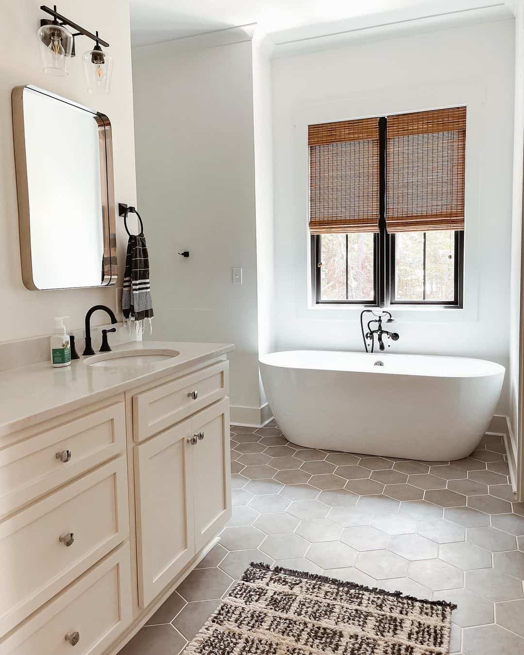 Freestanding Tub With Black Fixtures Creates a Dramatic Focal Point
