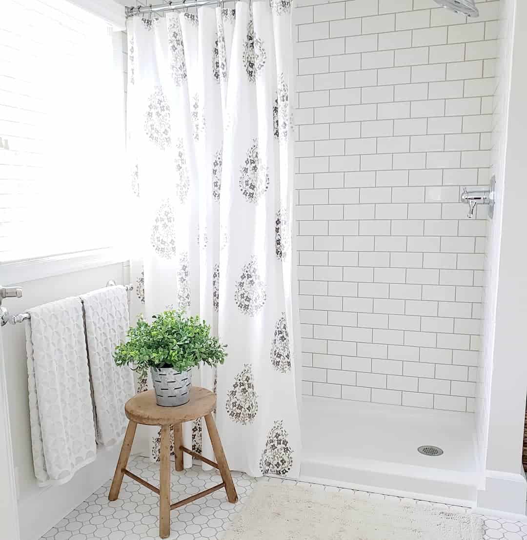 Soften White Subway Tile with a Botanical Shower Curtain